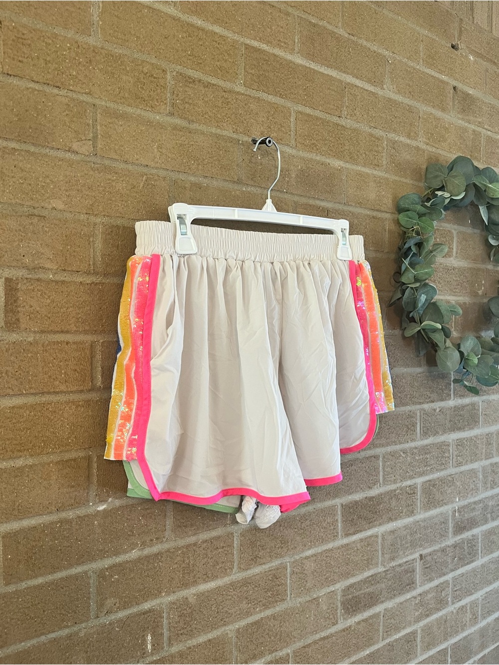 QUEEN OF SPARKLES Cream Athletic Shorts with Neon Pink Trim - Picture 2 of 3